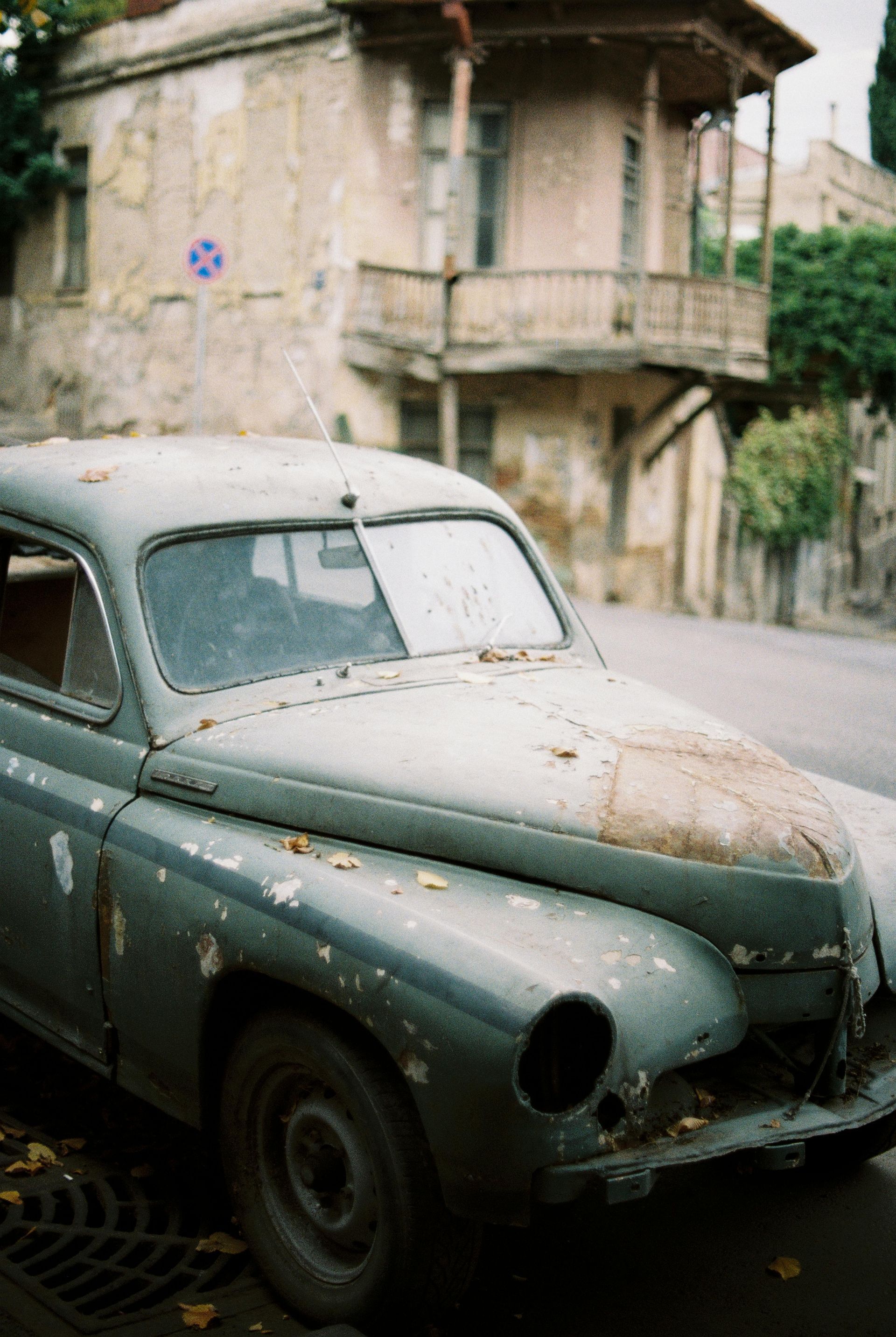 rusty vintage car and worn-out windshield
