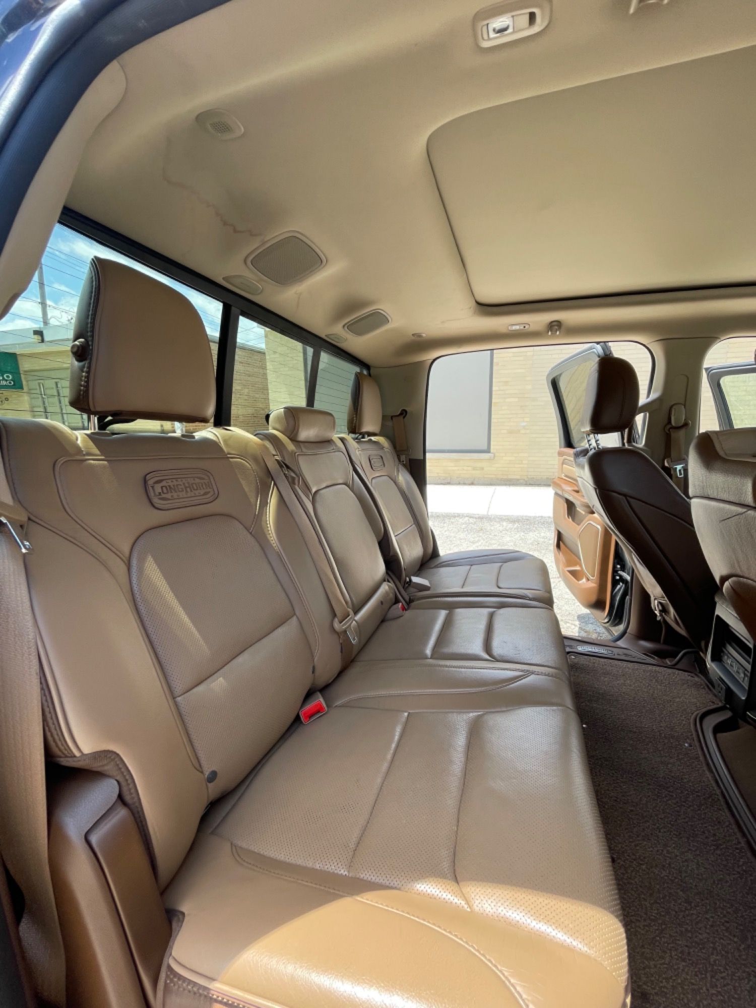 The back seat of a truck with a lot of seats.