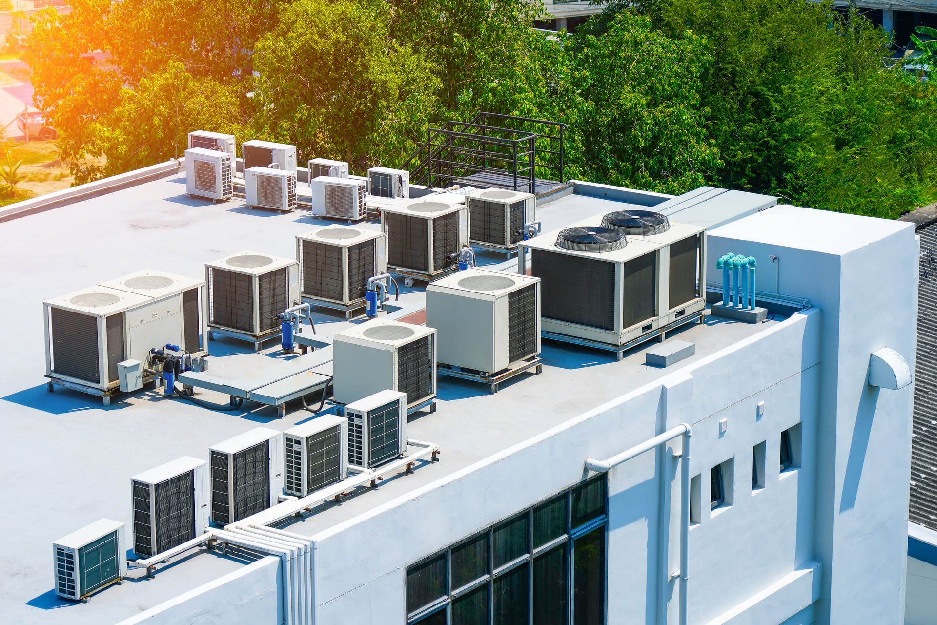 The external block units of the commercial air conditioning and ventilation systems are installed on the roof of an industrial building