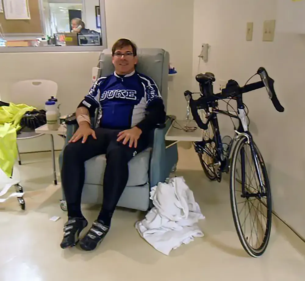 Martin Smith at the Duke Cancer Institute receiving chemo after riding across the country to raise money for cancer research