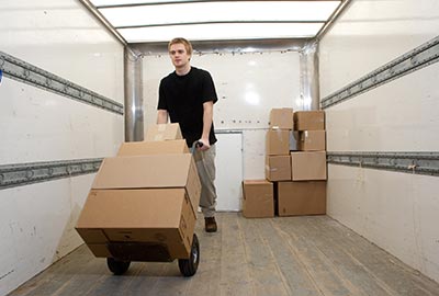 Man Unloading Box — Moving Company in Brooklyn, NY