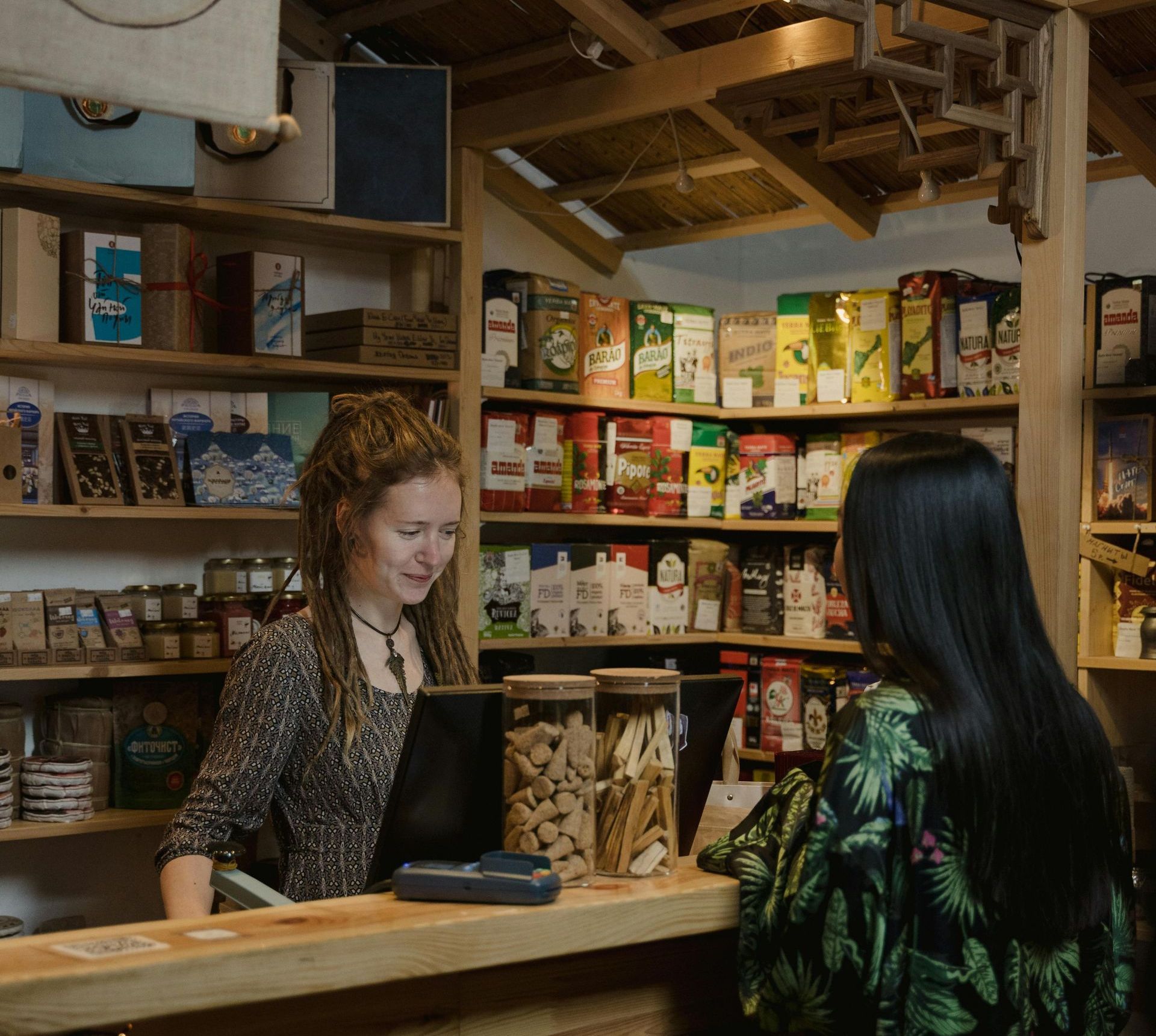 A woman is talking to an Ascent Grace Digital employee in a store