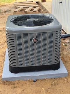 Light blue wall with windows and an air conditioning unit.