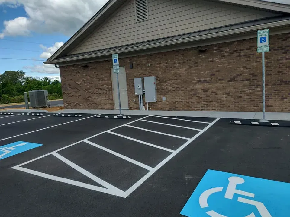 A handicapped parking spot in front of a building