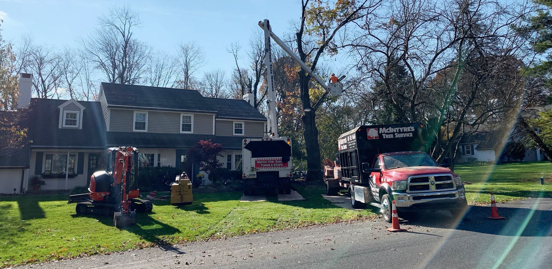 A red truck is parked in front of a house.