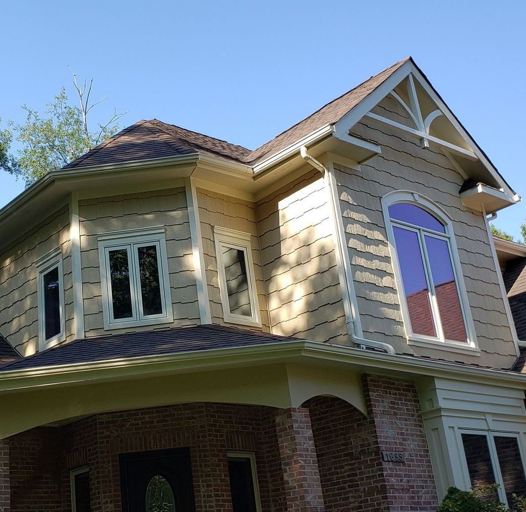 A large house with a triangle shaped roof