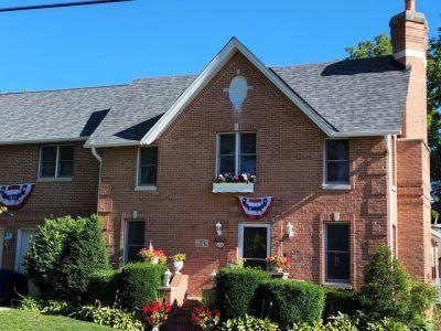A large brick house with a gray roof