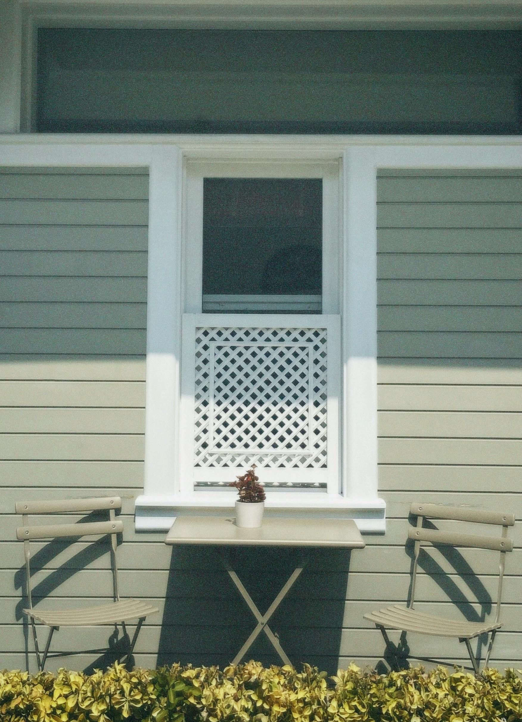 A table with an x on it sits outside of a house