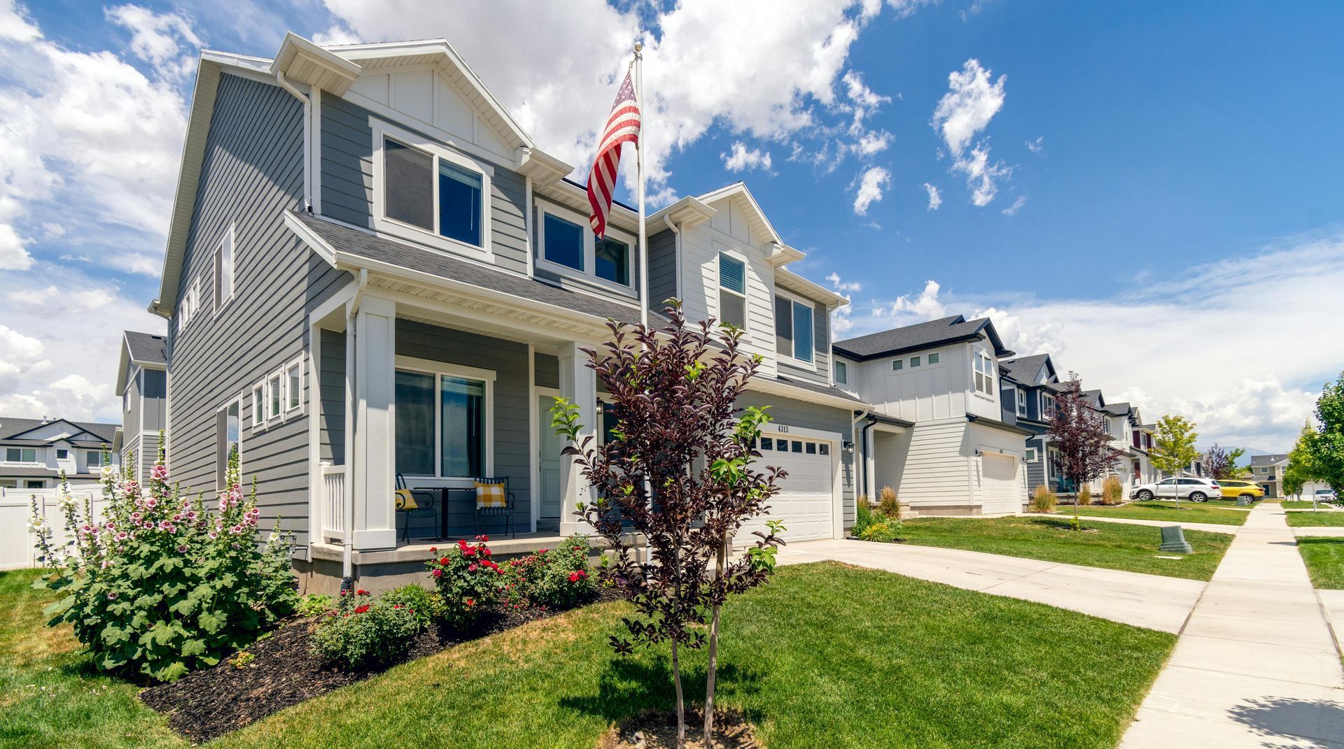 A house with an american flag flying in front of it.