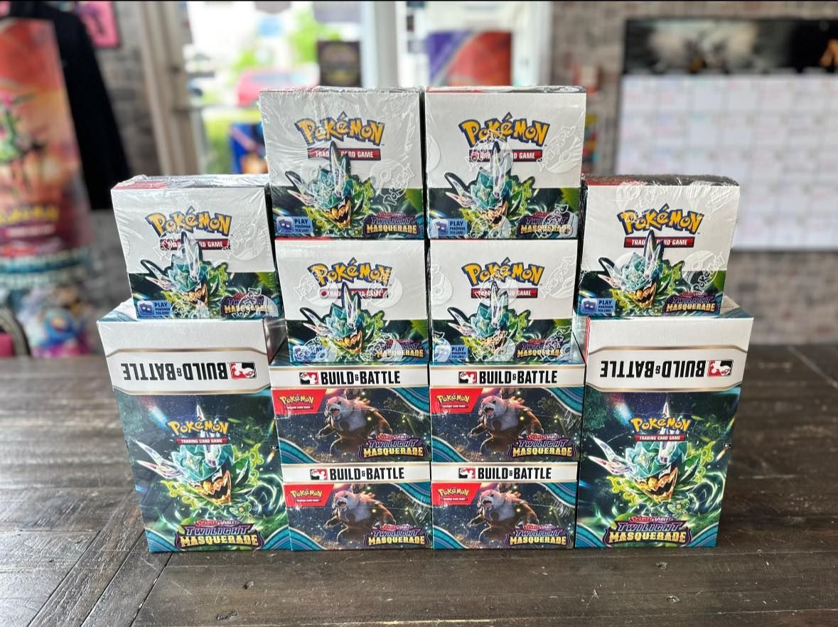 A bunch of pokemon cards are stacked on top of each other on a table.