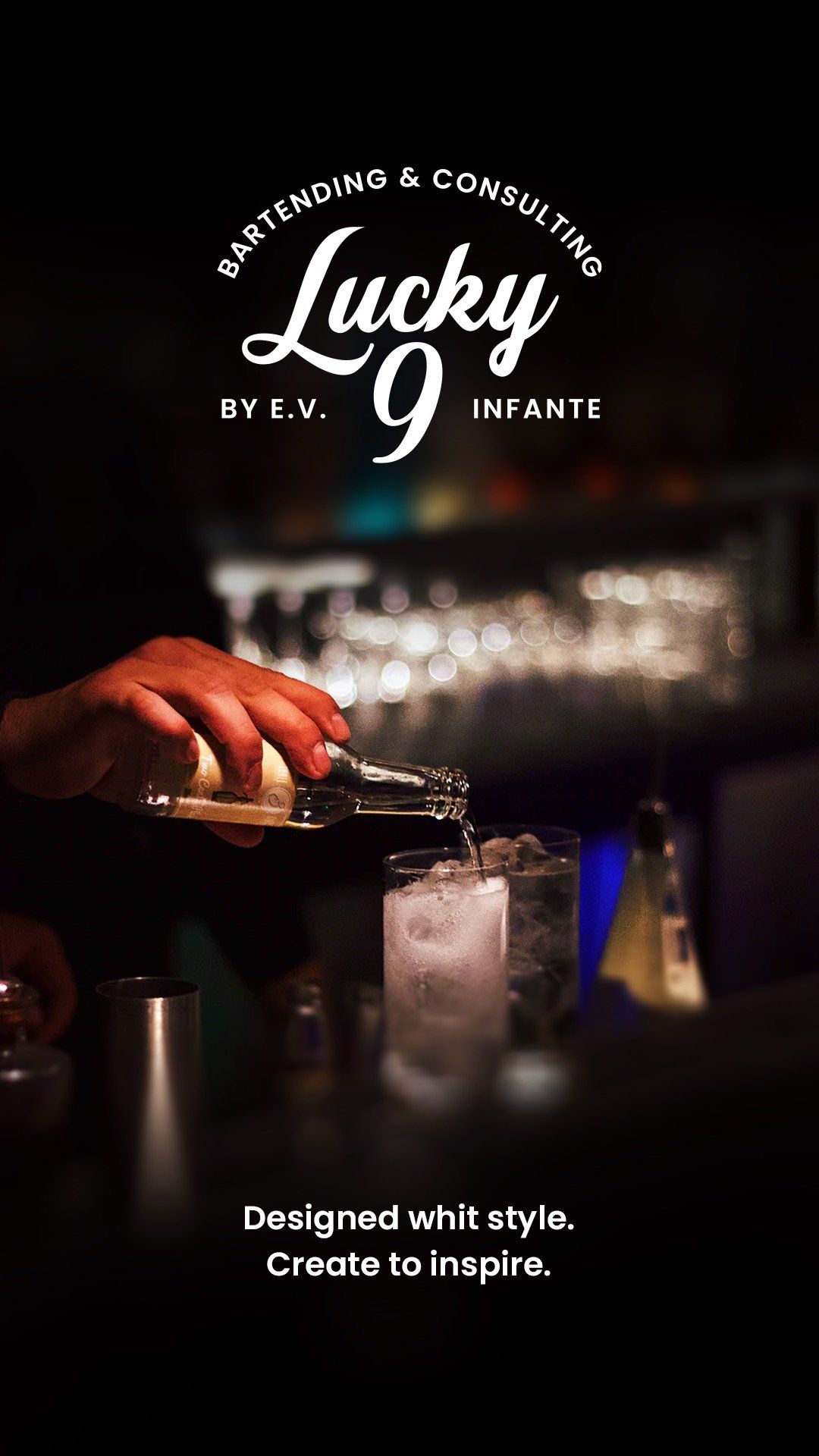 A bartender is pouring a drink into a glass.
