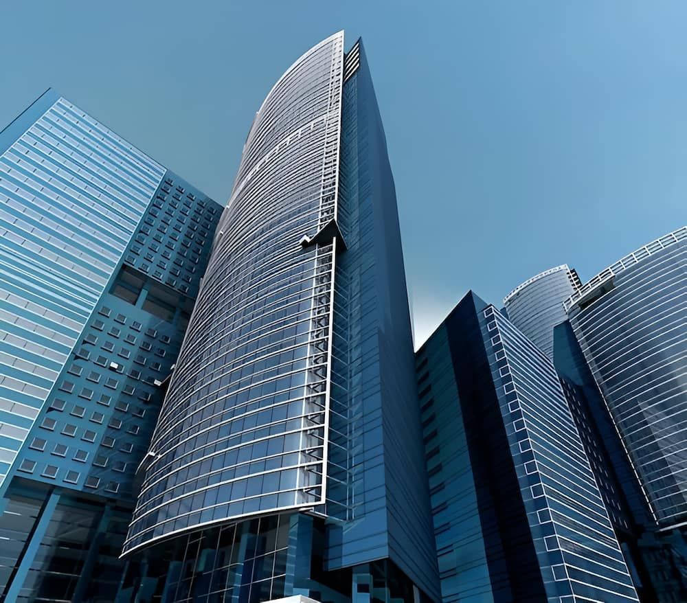 Modern Glass Skyscrapers Against a Bright Blue Sky — Curtis Strata in Yamba, NSW