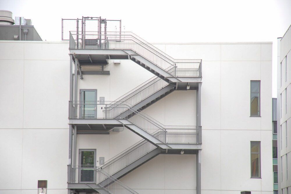 Metal Fire Escape on a White Building — Curtis Strata in Ballina, NSW