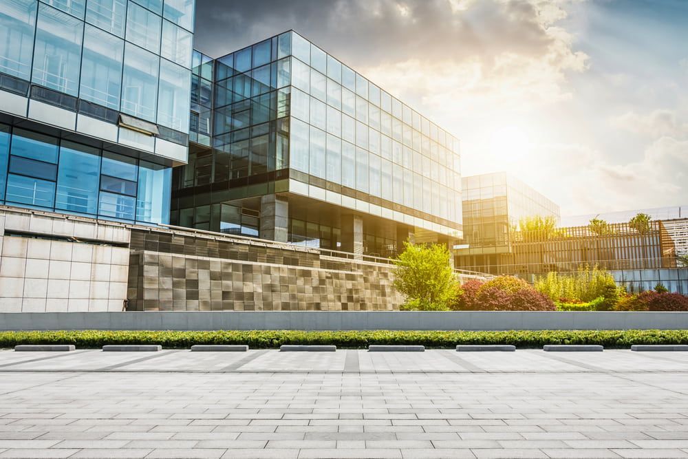 Modern Glass Office Buildings With Landscaping Under a Bright Sky — Curtis Strata in Casino, NSW