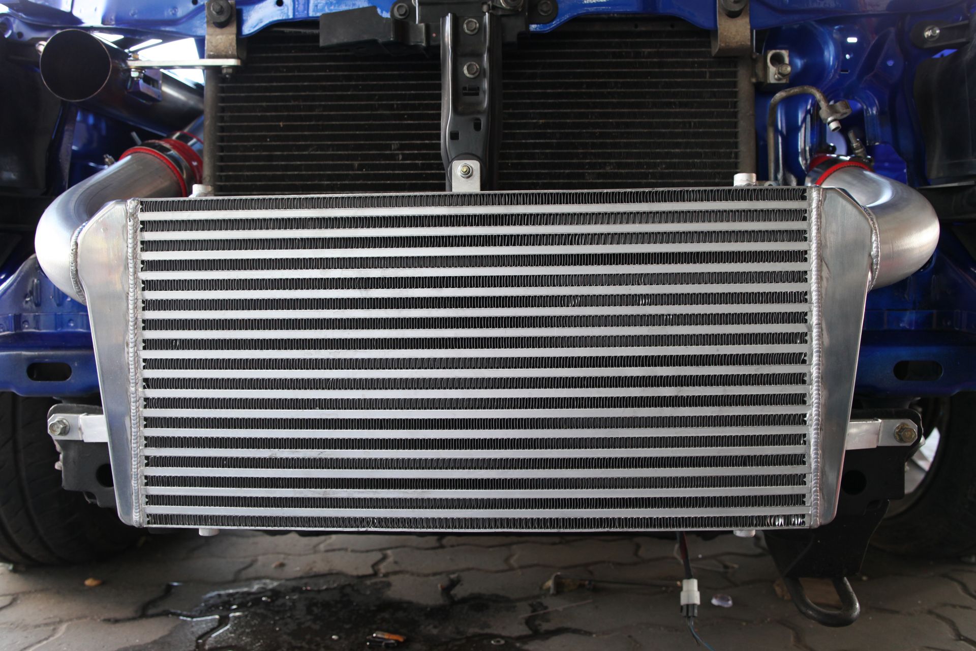 Blue Car With a Large, Silver Intercooler Mounted in the Front — Independent Scrap Metal Pty Ltd in South Lismore, NSW