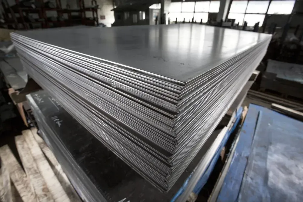 Stack of Metal Sheets in a Warehouse Setting, Possibly Steel — Independent Scrap Metal Pty Ltd in Clarence Valley, NSW