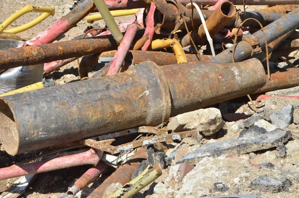 Rusty Metal Pipes and Wiring in a Pile of Debris — Independent Scrap Metal Pty Ltd in Murwillumbah, NSW