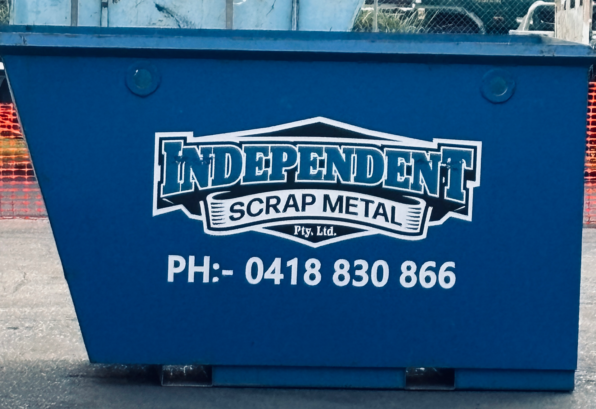 Truck With Crane Loading a Red Agricultural Bin — Independent Scrap Metal Pty Ltd in South Lismore, NSW