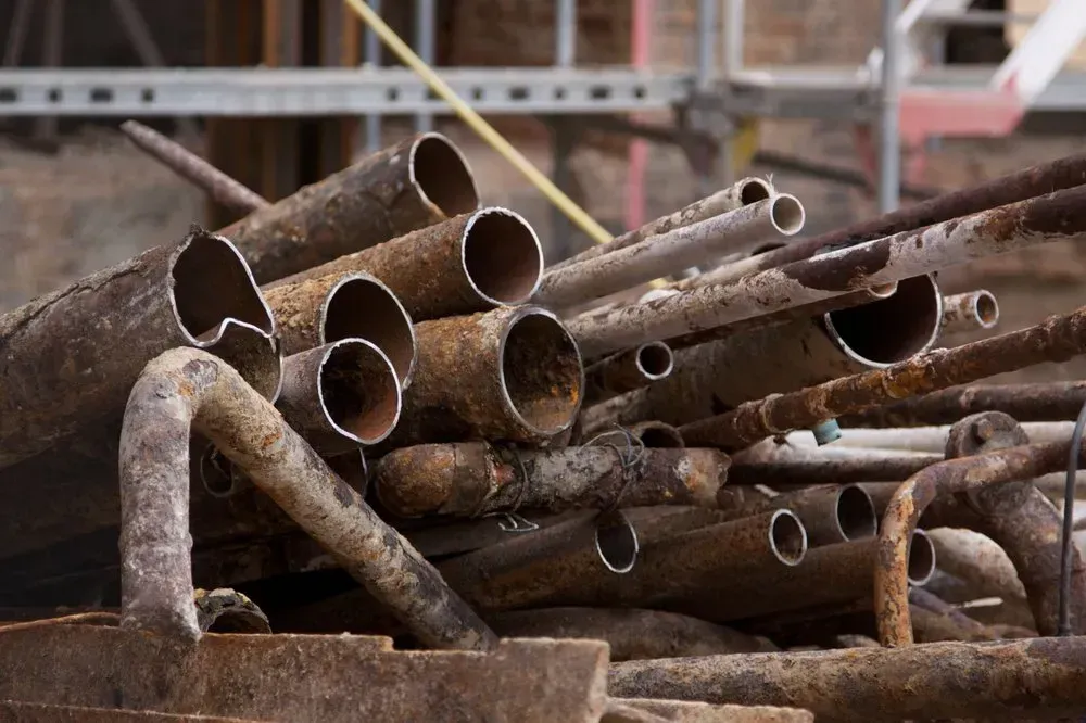 Rusty Metal Pipes Piled Together — Independent Scrap Metal Pty Ltd in South Lismore, NSW