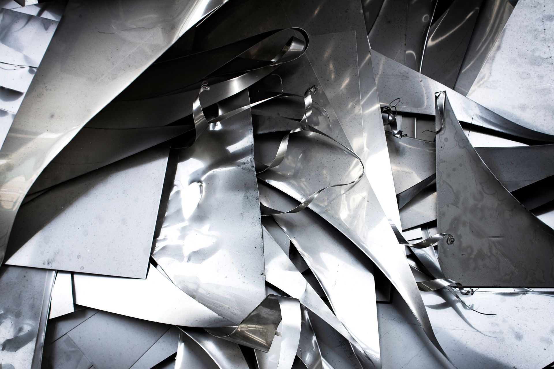 Pile of Jagged, Shiny Metal Scraps, Likely Stainless Steel — Independent Scrap Metal Pty Ltd in Yamba, NSW