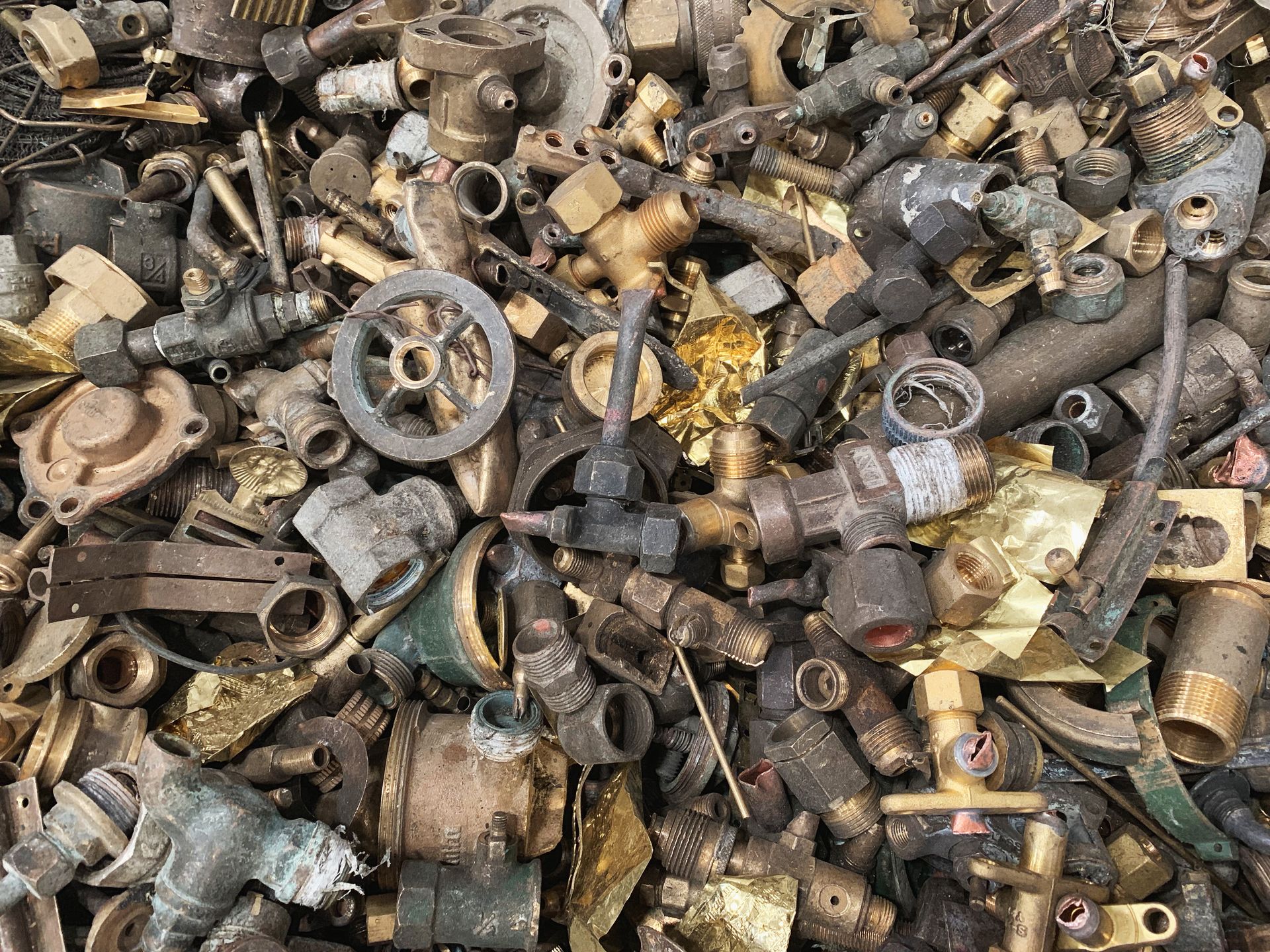 Pile of Mixed Brass and Metal Scrap Parts, Fittings, and Components — Independent Scrap Metal Pty Ltd in Casino, NSW