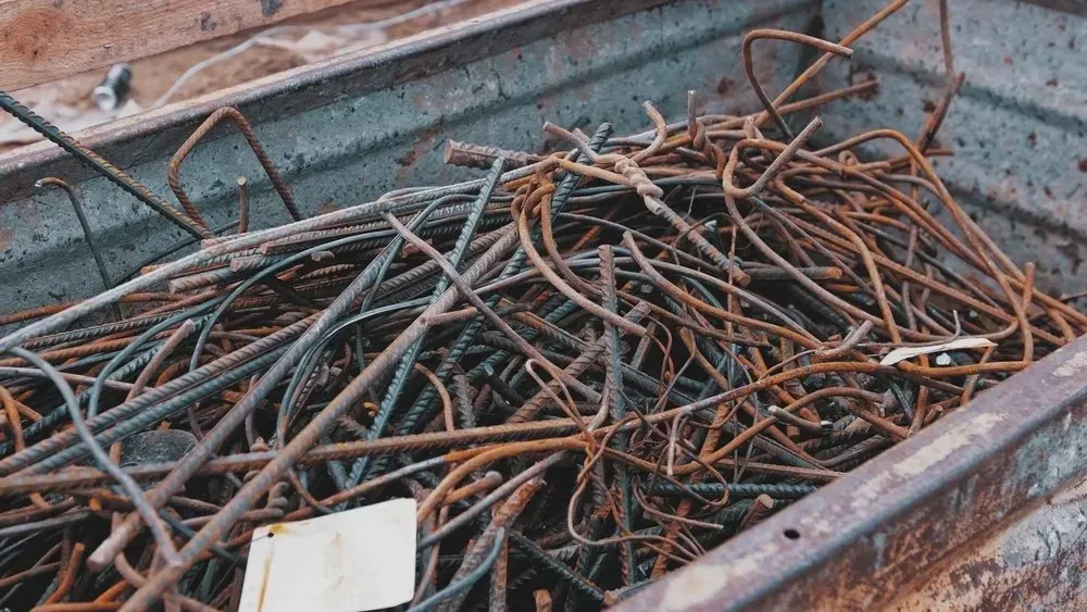 Pile of Rusty, Bent Steel Rods in a Metal Container — Independent Scrap Metal Pty Ltd in Grafton, NSW