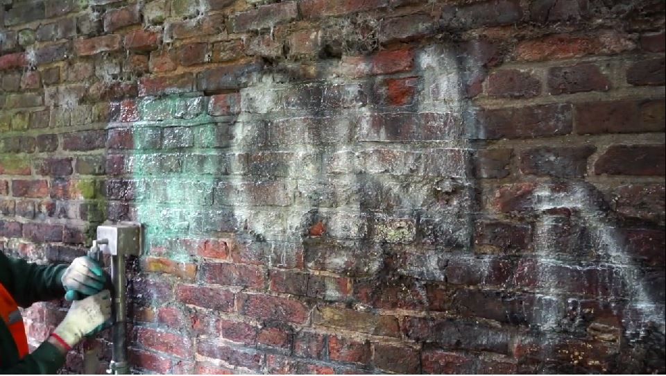 Graffiti on wall before being removed with ThermaTech Steam Cleaner