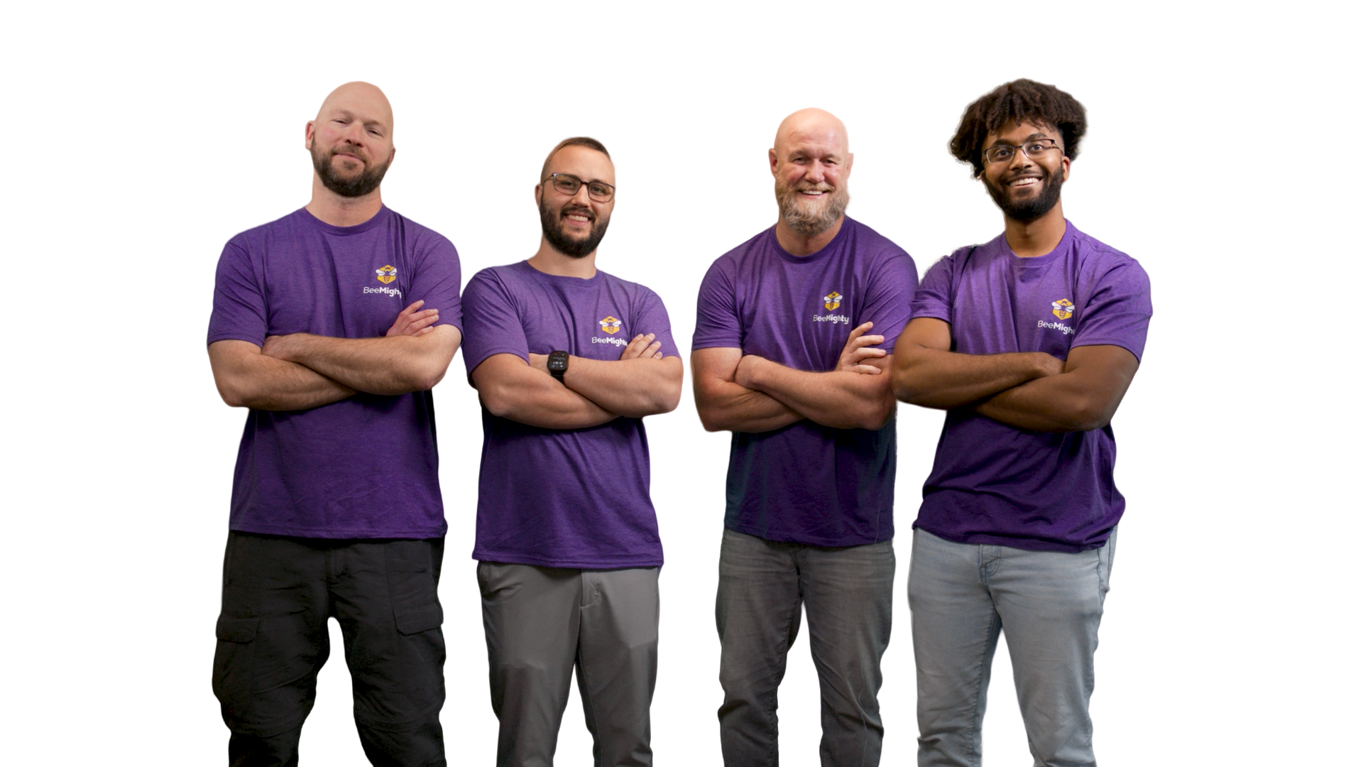 Four men in purple shirts with arms crossed, standing against a white backdrop.