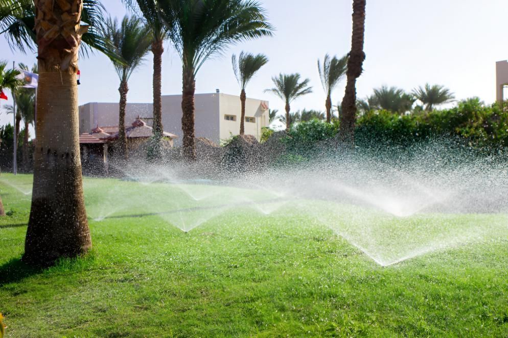 Lawn Sprinklers Watering Green Grass — iWater NT Pty Ltd in Yarrawonga, NT