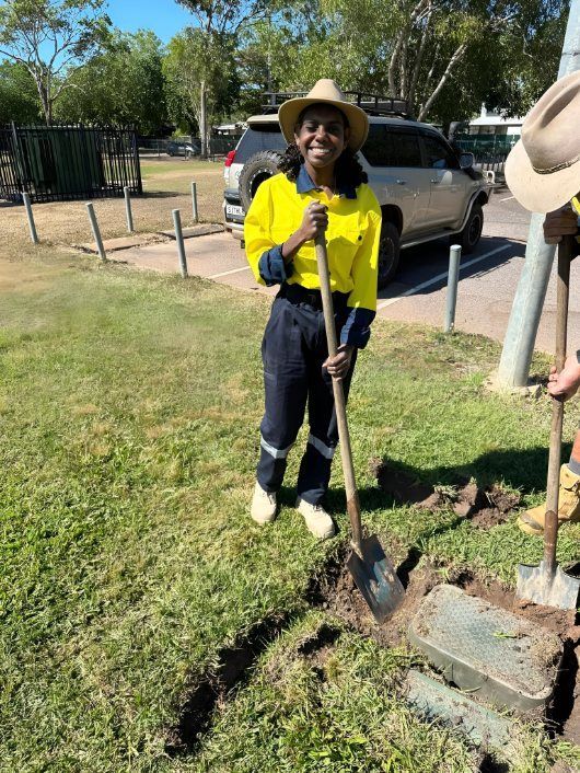 Woman in Work Clothes Smiling — iWater NT Pty Ltd in Yarrawonga, NT