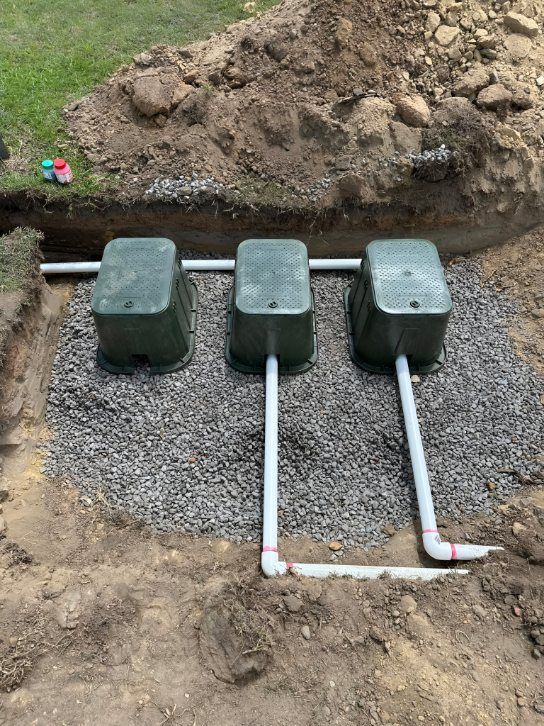 Three Green Utility Boxes With White Pipes — iWater NT Pty Ltd in Yarrawonga, NT