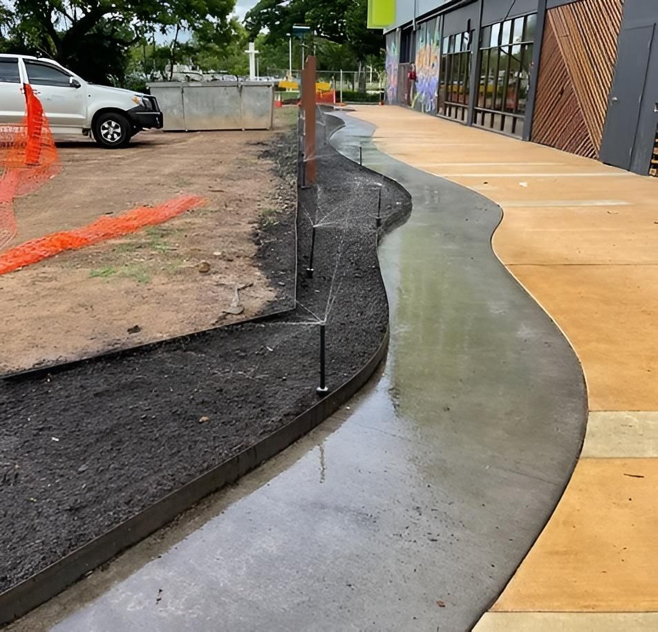 Newly Poured Concrete Sidewalk With Curved Design — iWater NT Pty Ltd in Yarrawonga, NT