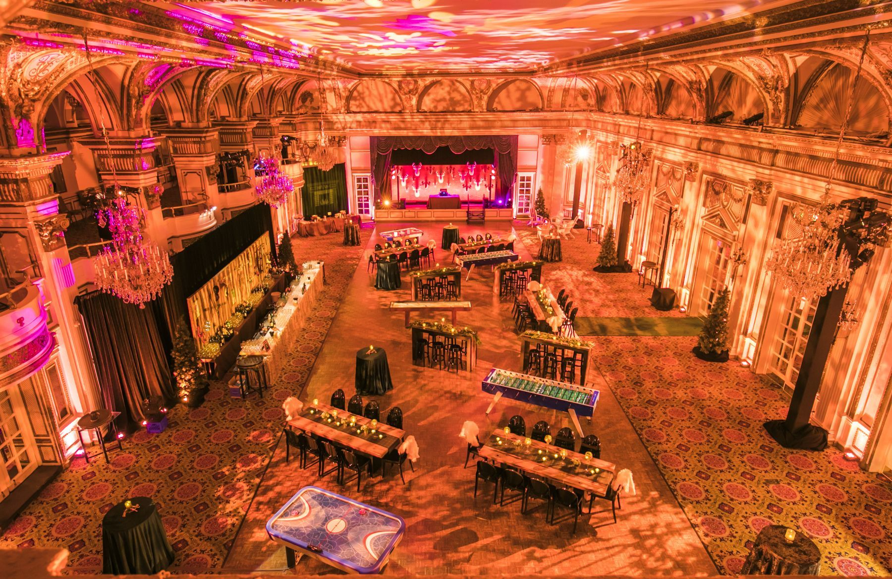 An aerial view of a large room filled with tables and chairs.