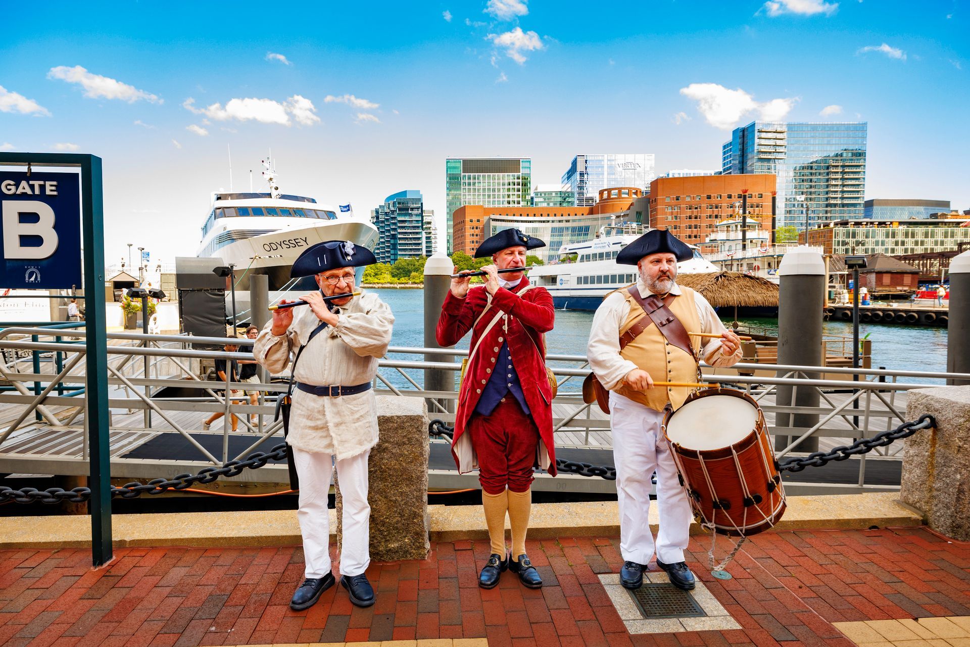 three band players dressed in colonial costumes.