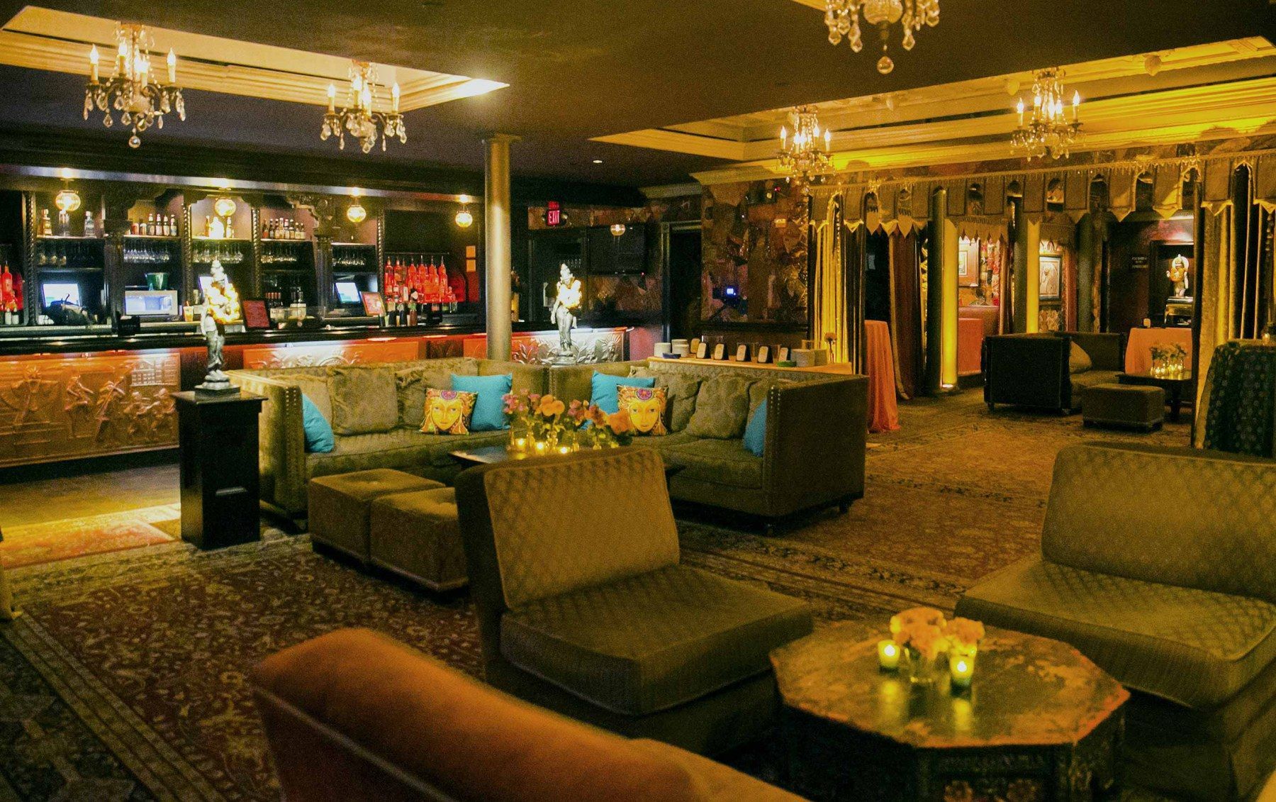 A large room with a lot of furniture and a bar