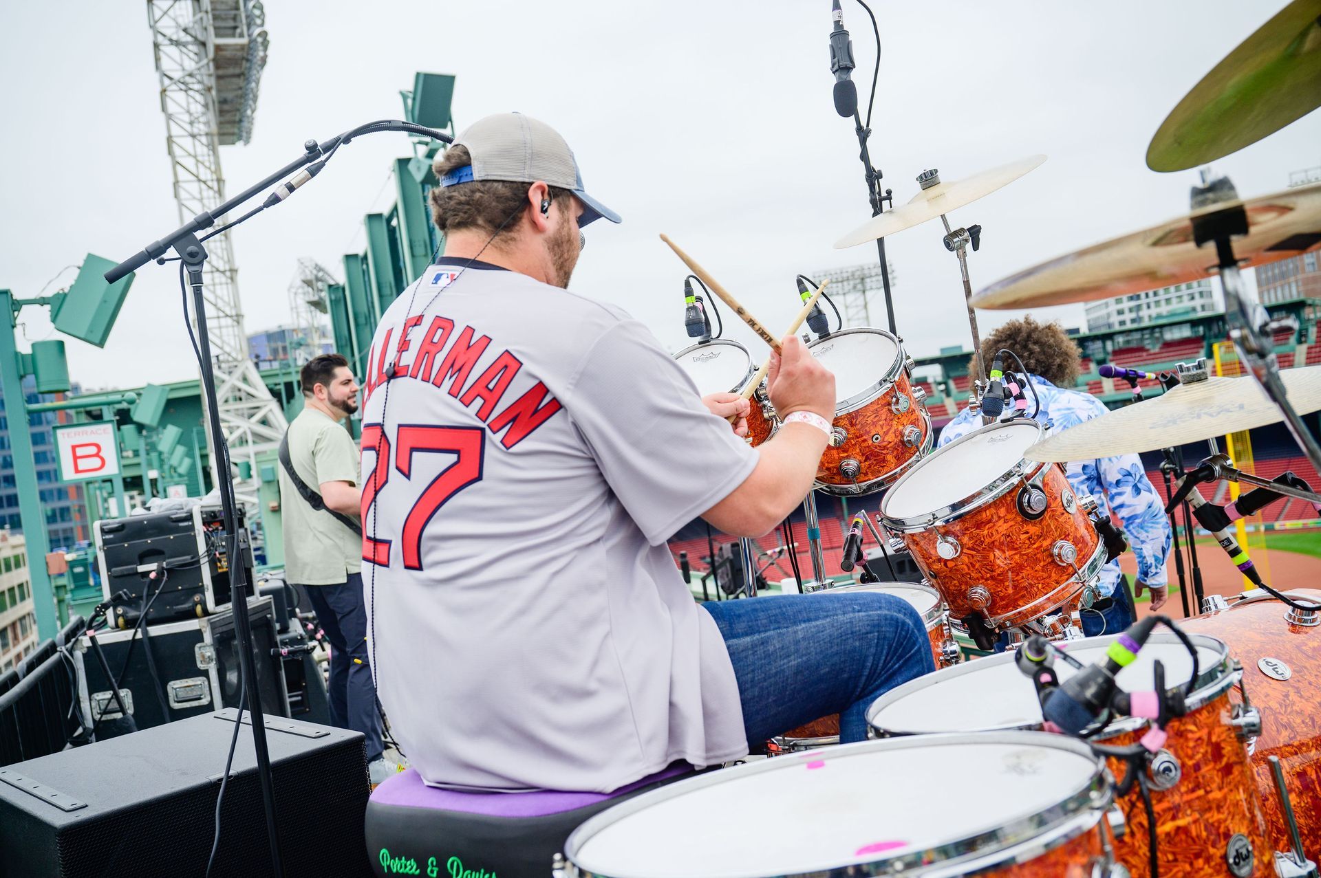 Drummer in a gray jersey with the name 