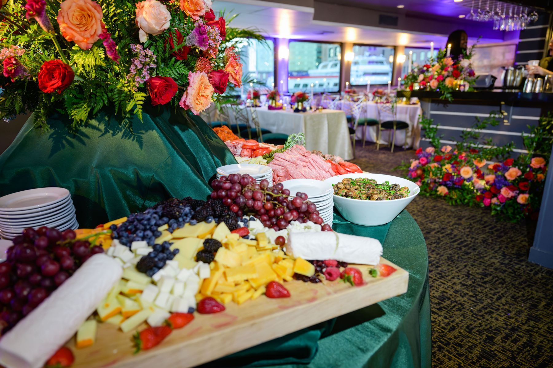 A buffet table with a variety of fruits and vegetables on it.