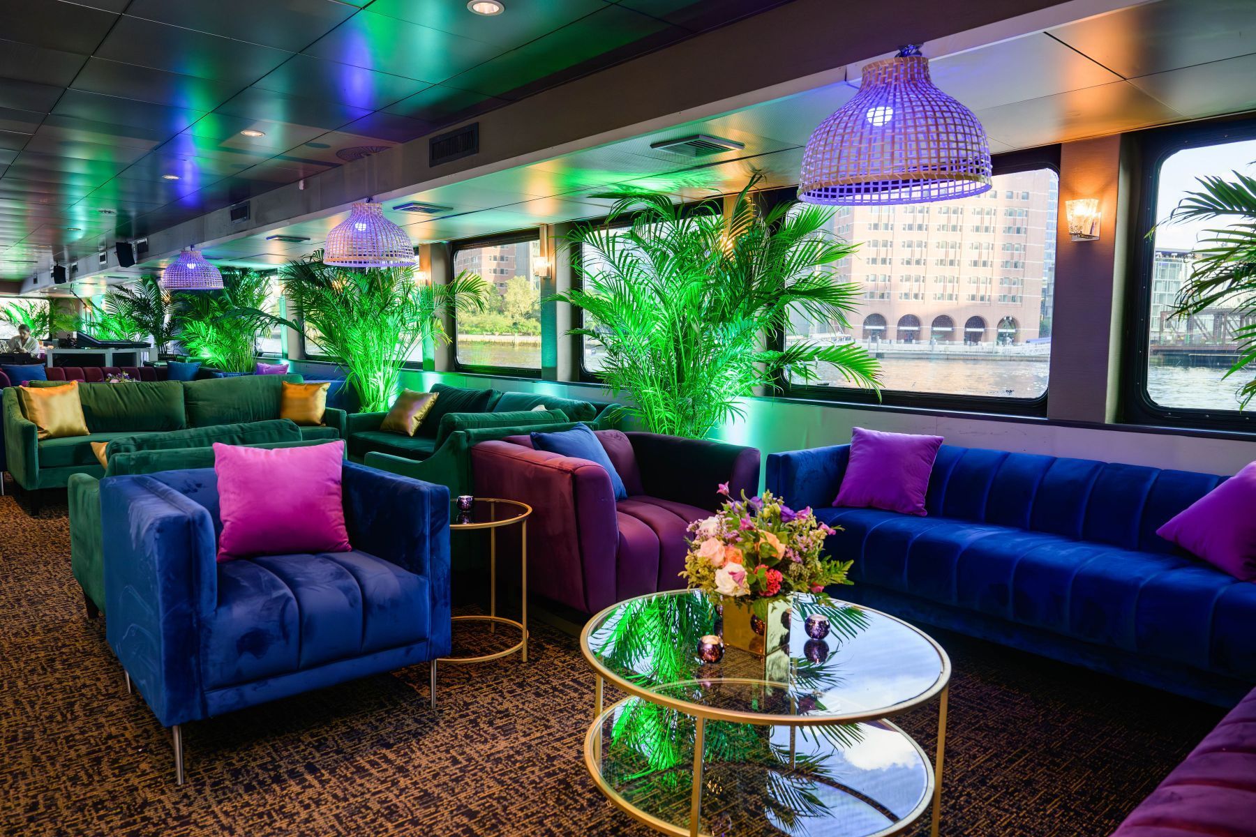 There are many couches and chairs in the room.