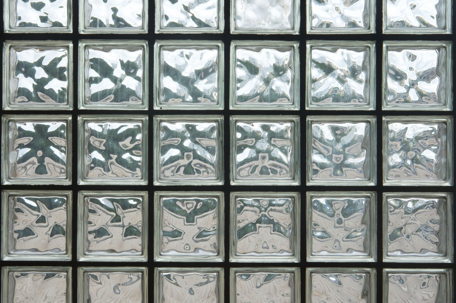 A close-up of a wall made of glass blocks.