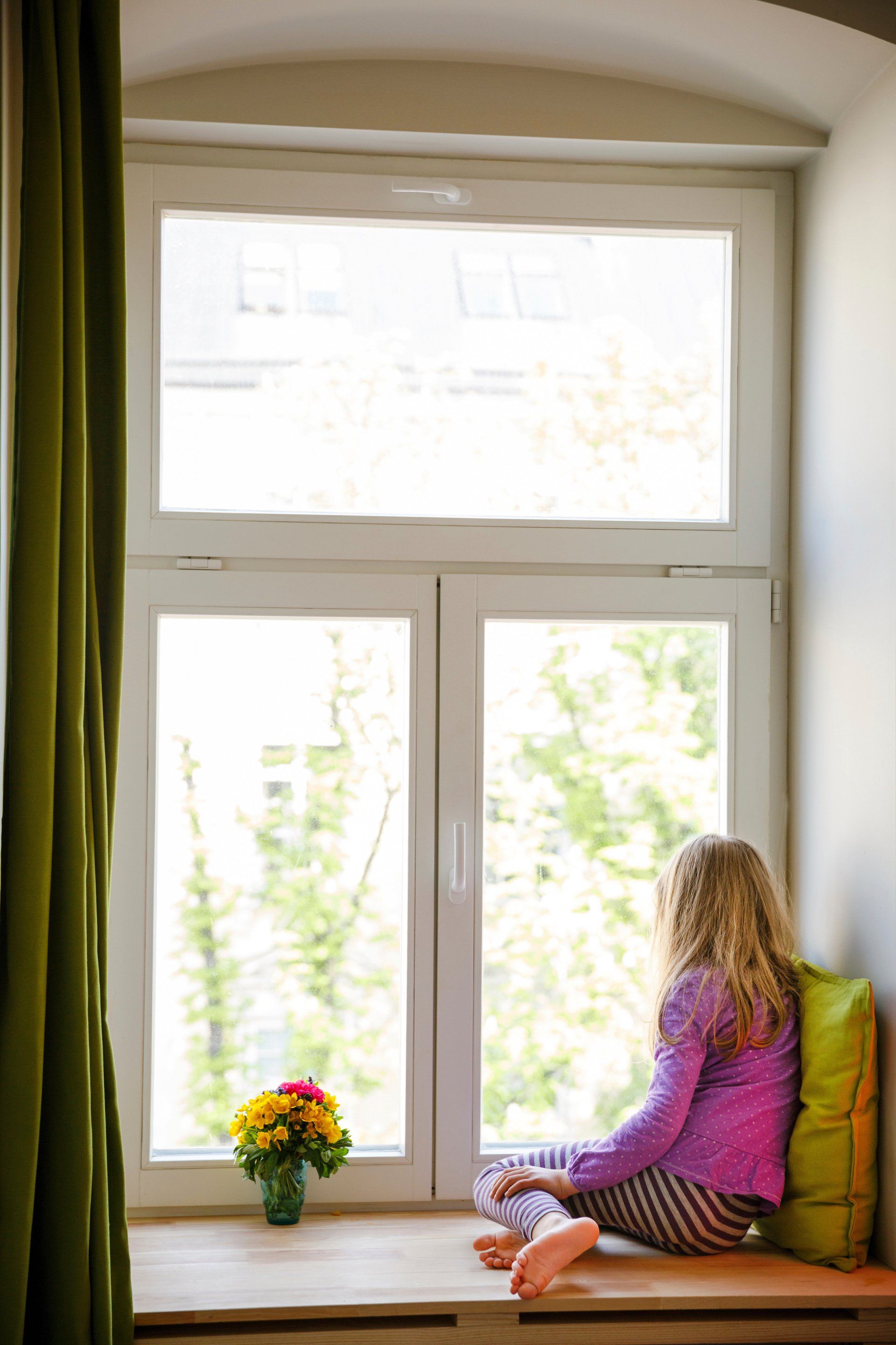 a child sitting by the window