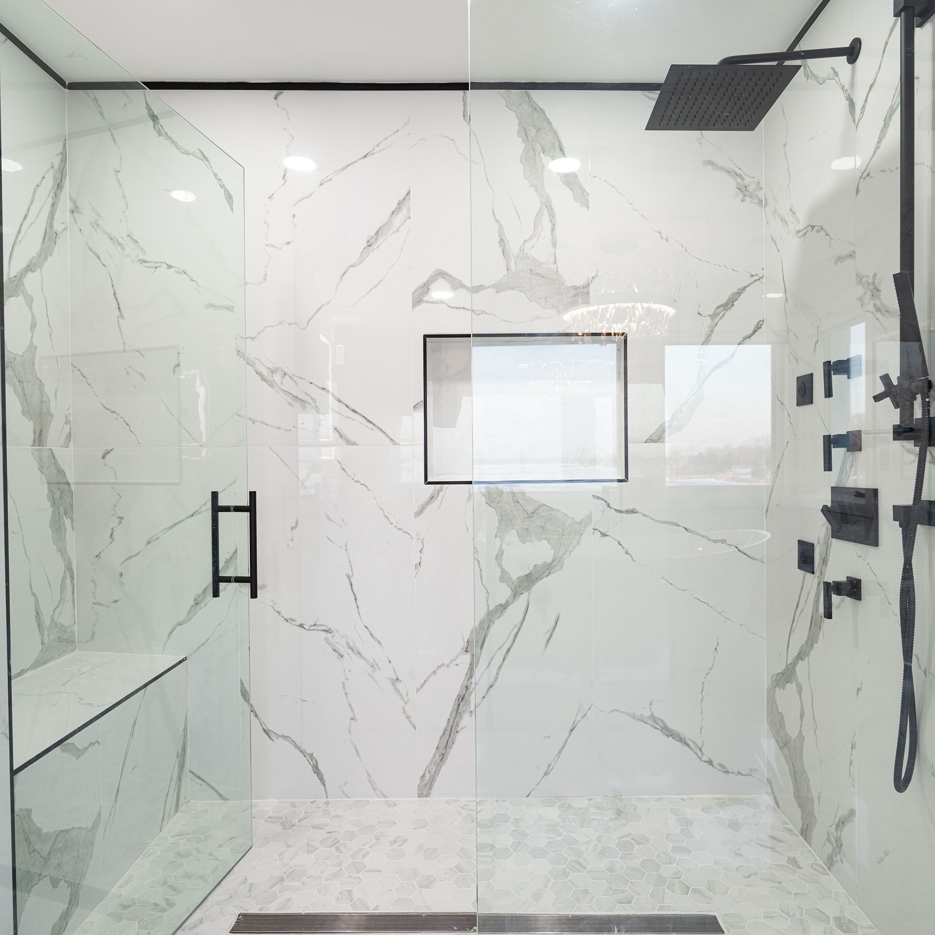 Shower with toughened glass walls.