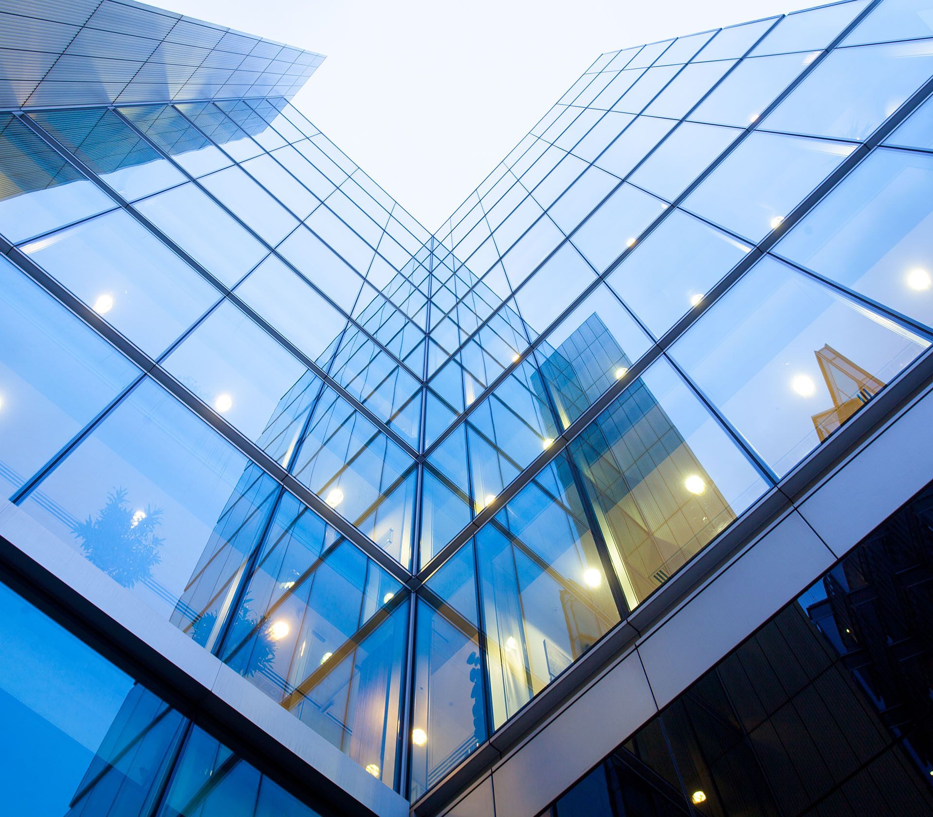 Looking up at a building with a lot of windows.