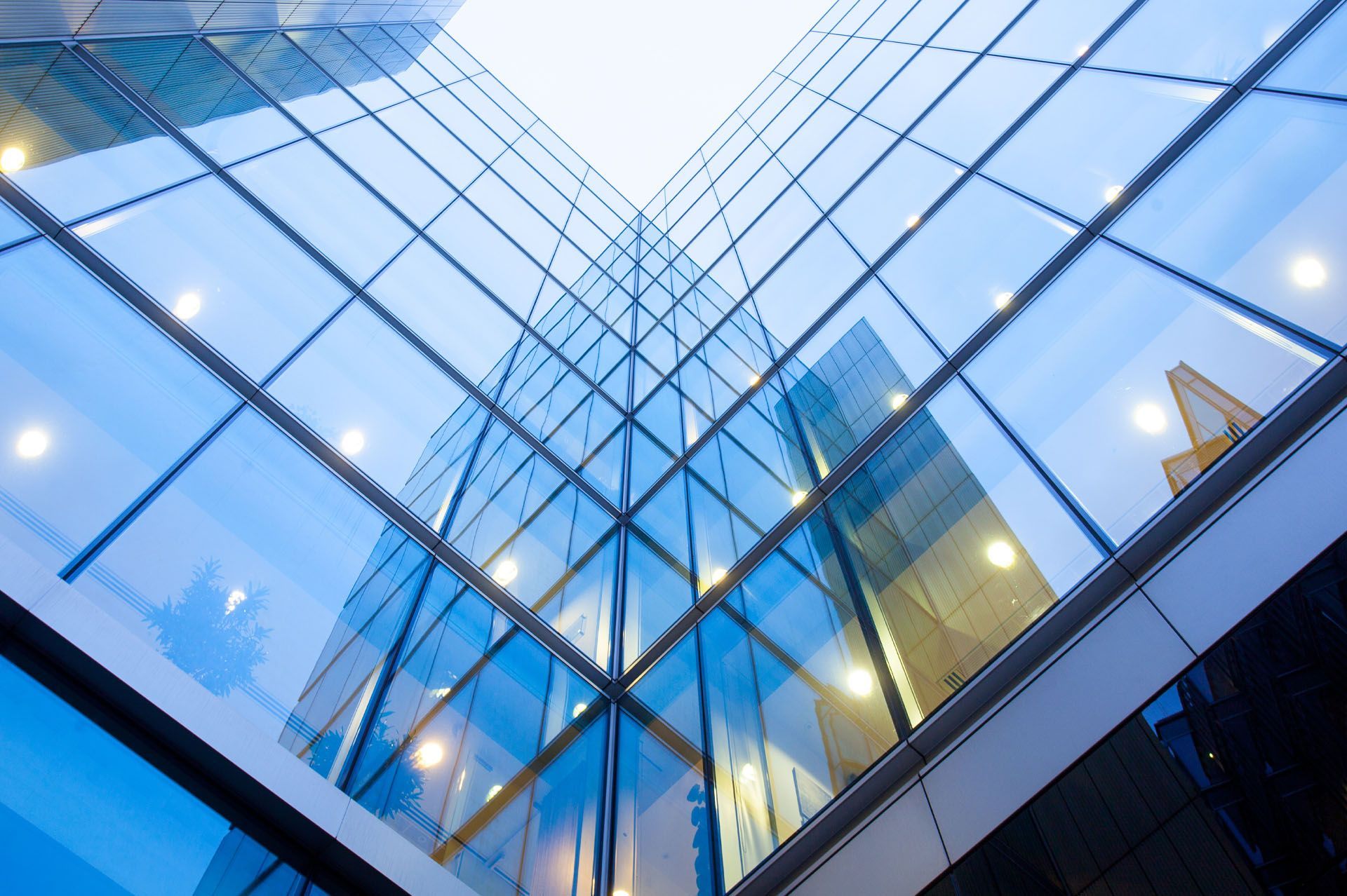 Looking up at a tall building with a lot of windows.