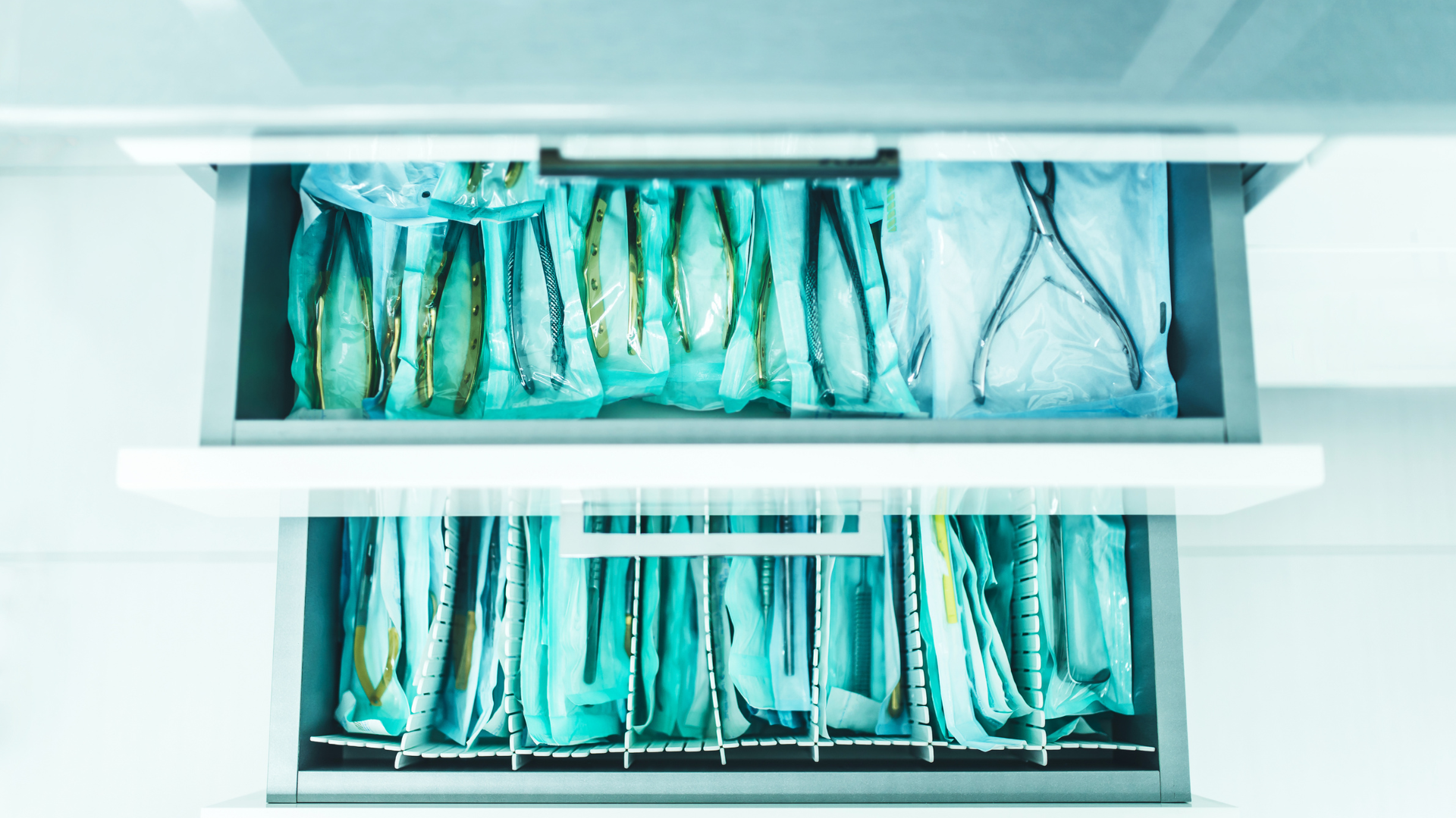 A row of drawers filled with surgical instruments in a hospital.