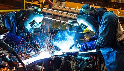 Team of metal fabrication working together