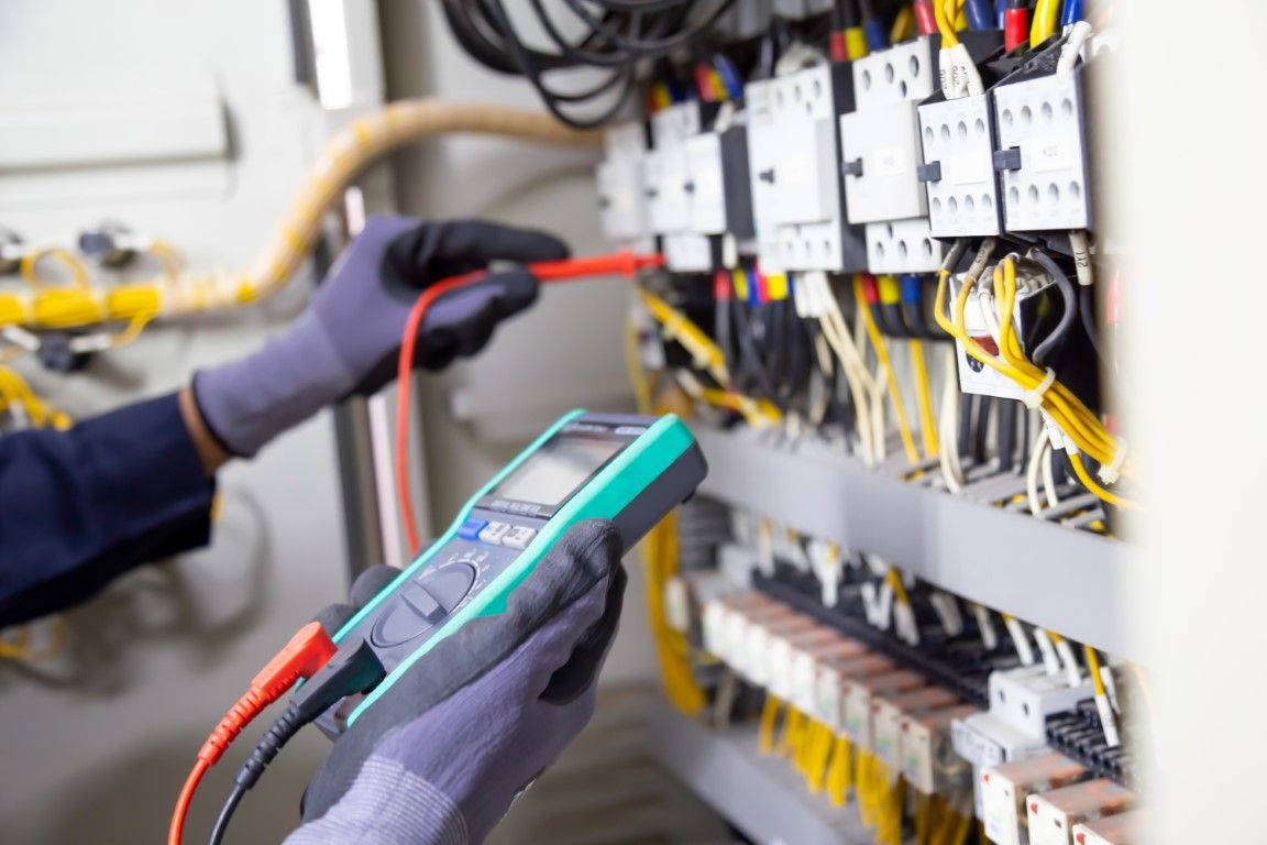 Electrician crimping ethernet cable.