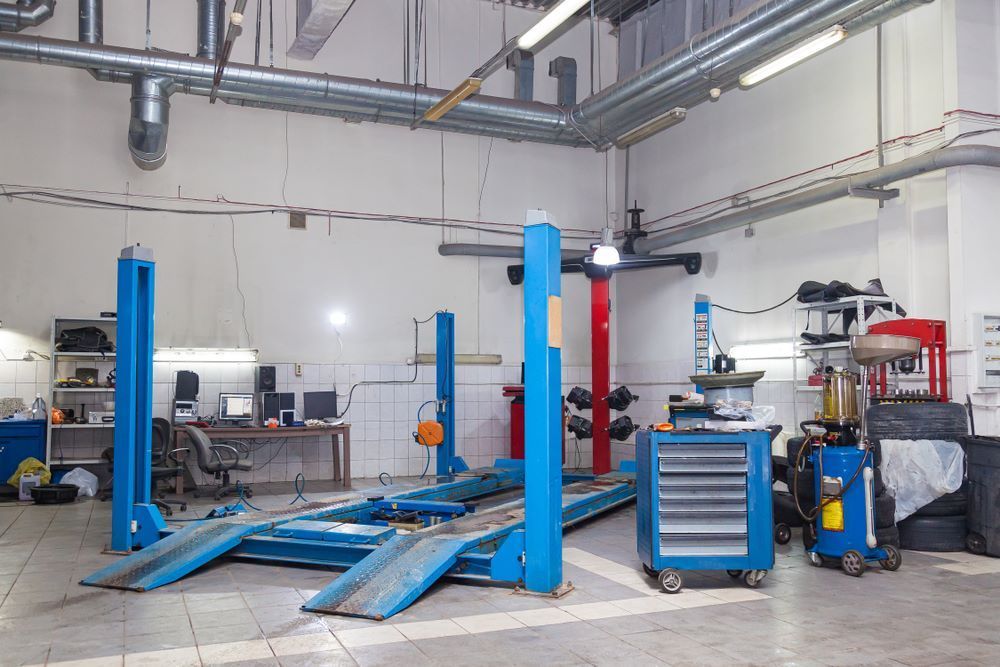 A Garage with A Lot of Machinery and Tools in It — Mahers Smash Repairs in Tamworth, NSW