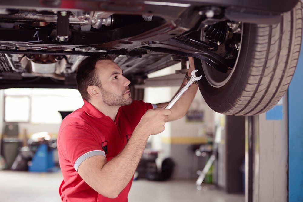 Mechanic Checking Wheel — Experience Mechanic in Canberra
