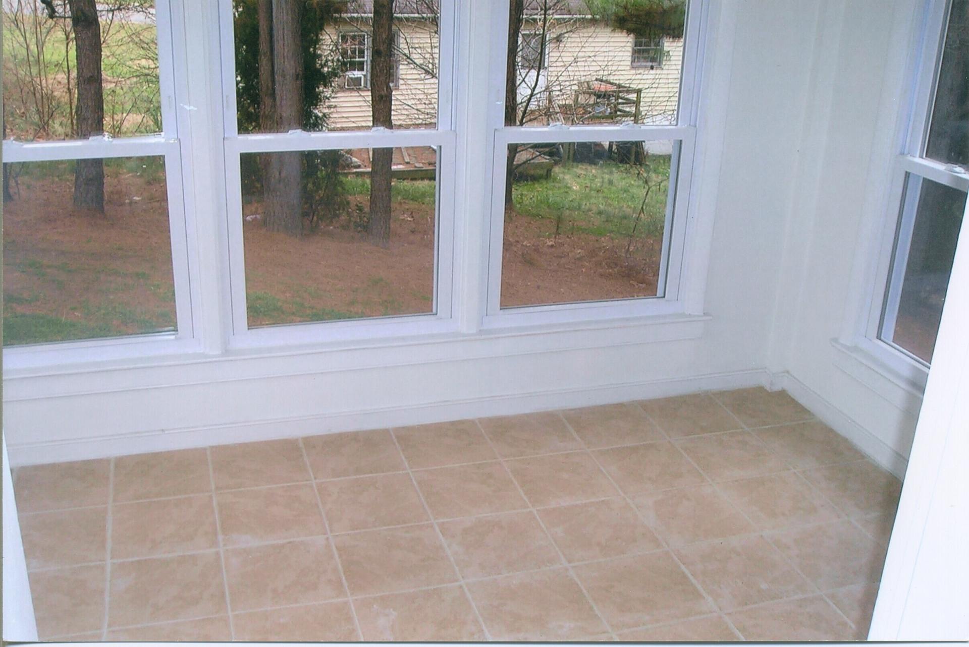 New Tiled Floor - API Roofing & Construction in Richmond, VA