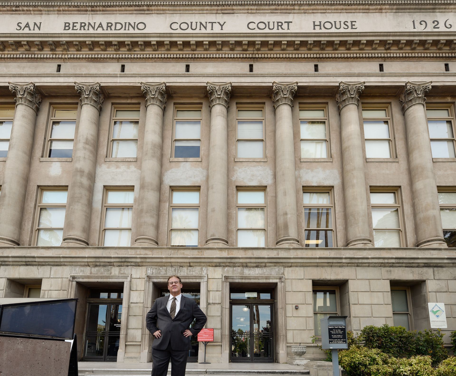 Attorney Gregory Kassel stands in front of the San Bernardino county court house. 